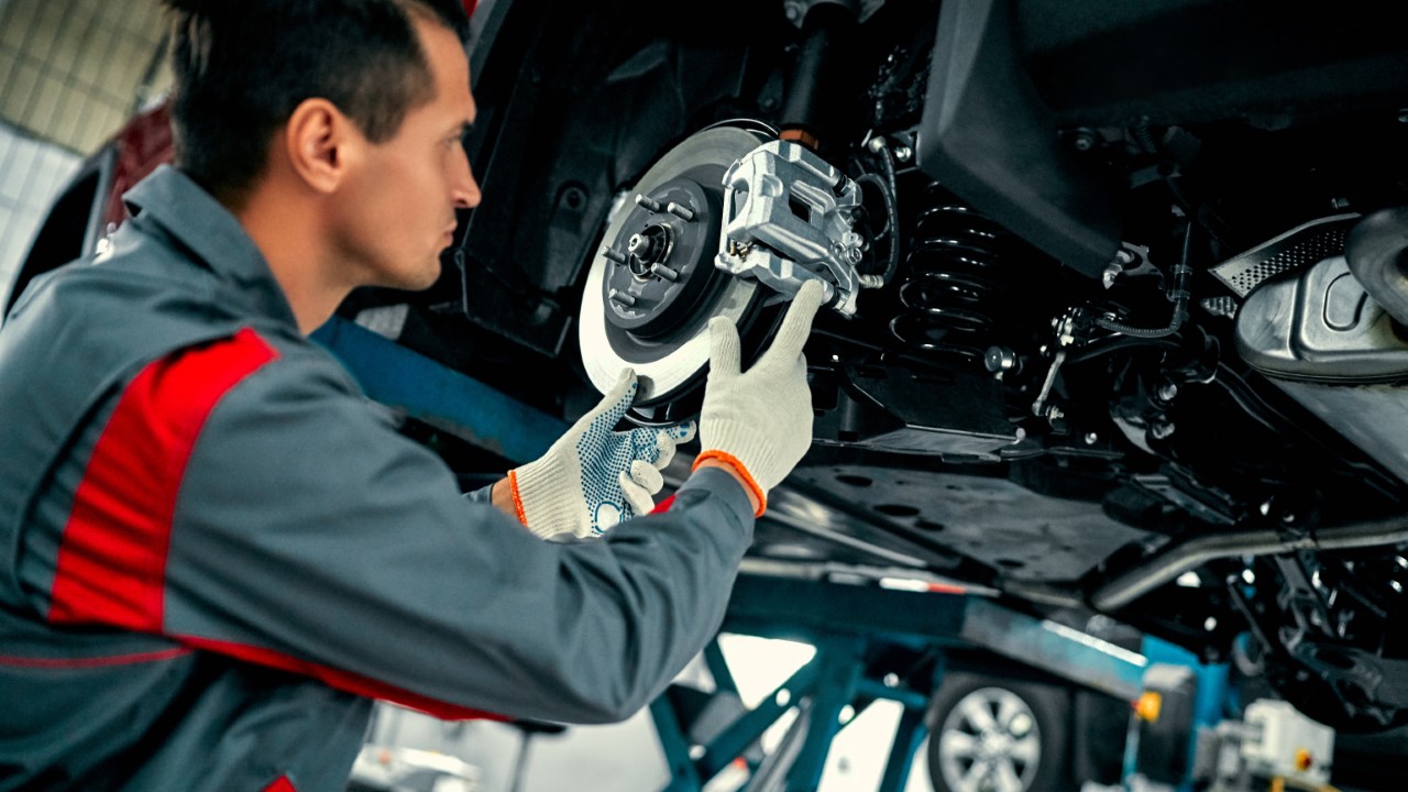 Mechanic fixing a car.