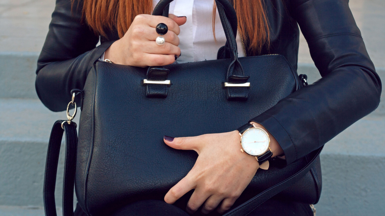 Woman holding a purse.