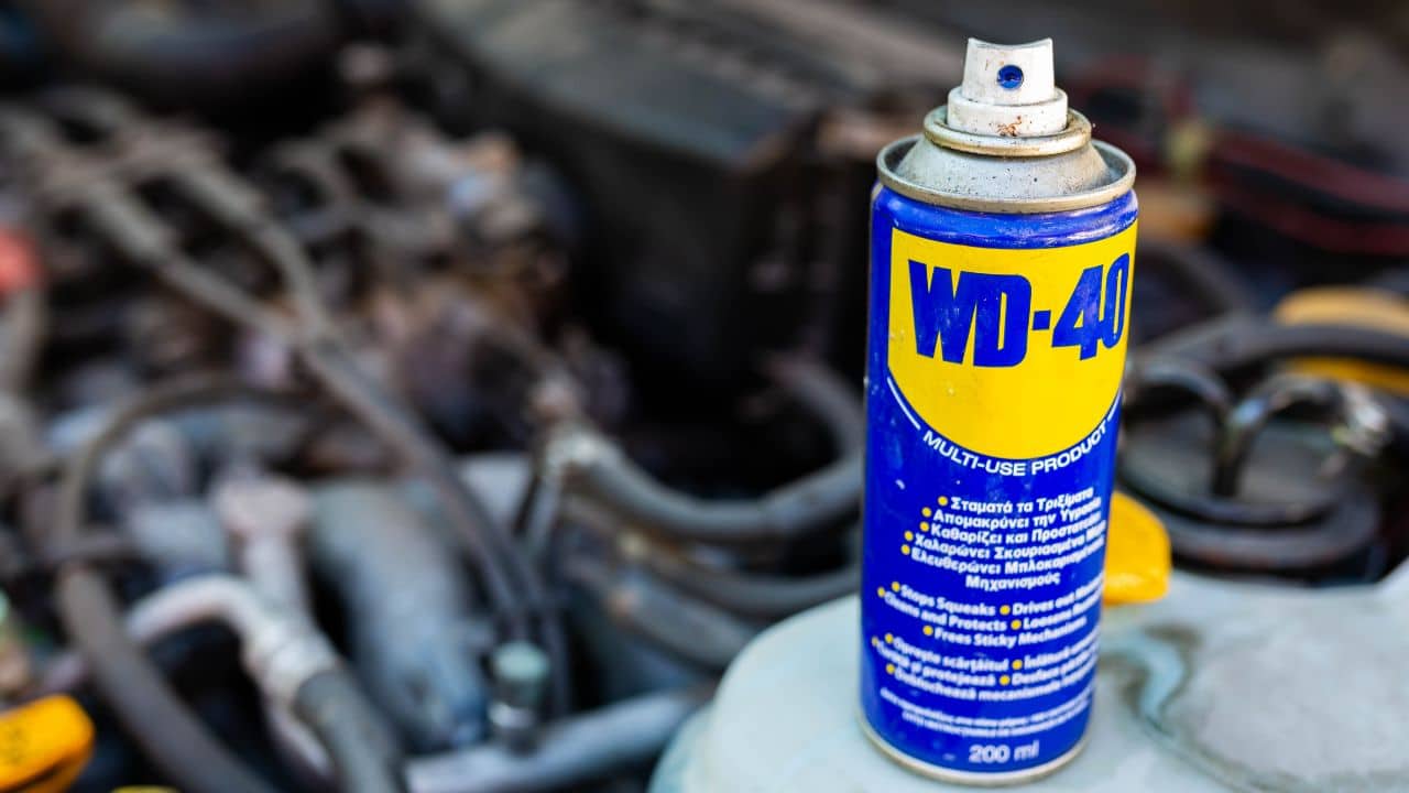 Miercurea Ciuc, Romania- 26 July 2022: WD-40 multi purpose penetrating oil on old japanese car engine,