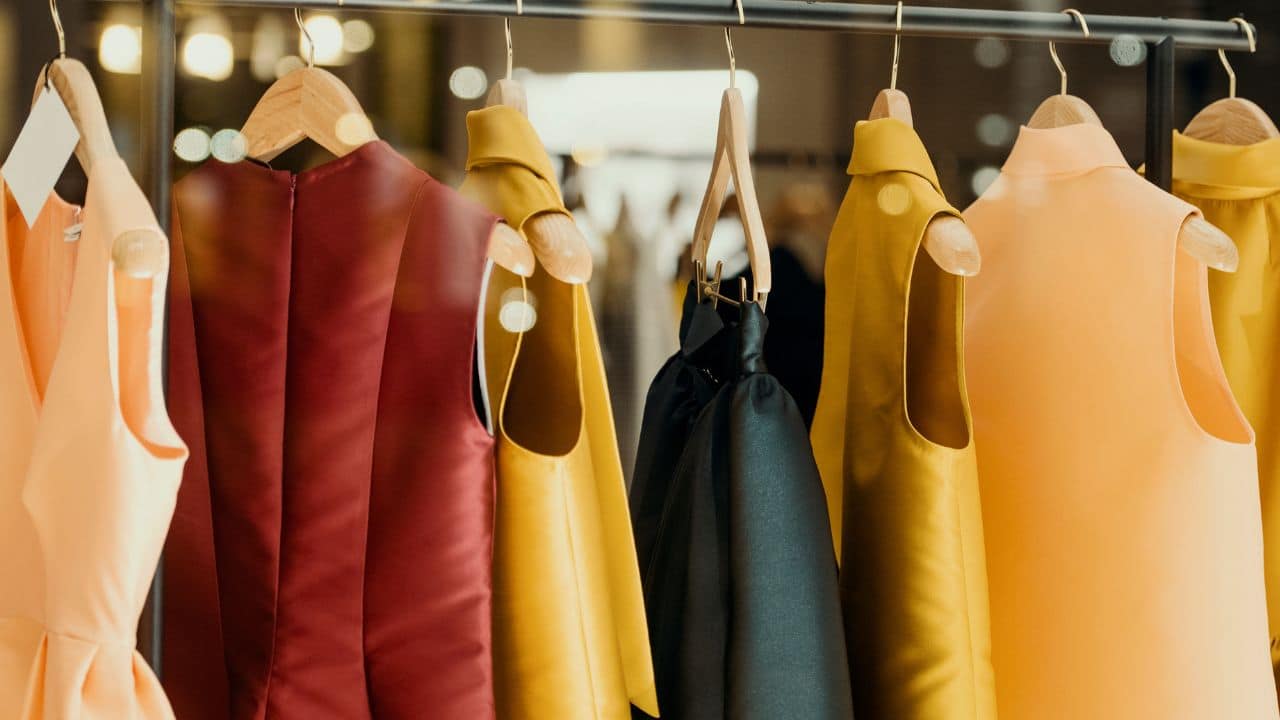 shopping concept - colorful clothing in a fancy store