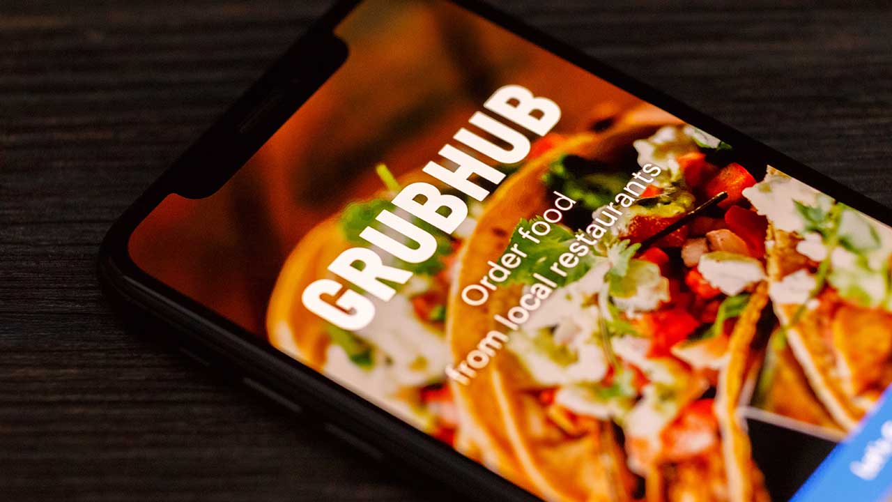GrubHub logo seen displayed on smart phone. Grubhub Inc. is an online and mobile food-ordering company that connects diners with local restaurants.