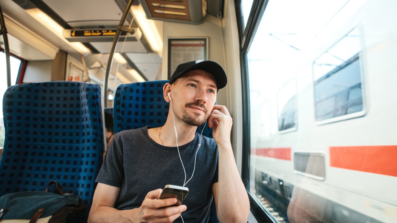 Man listening to music in a train