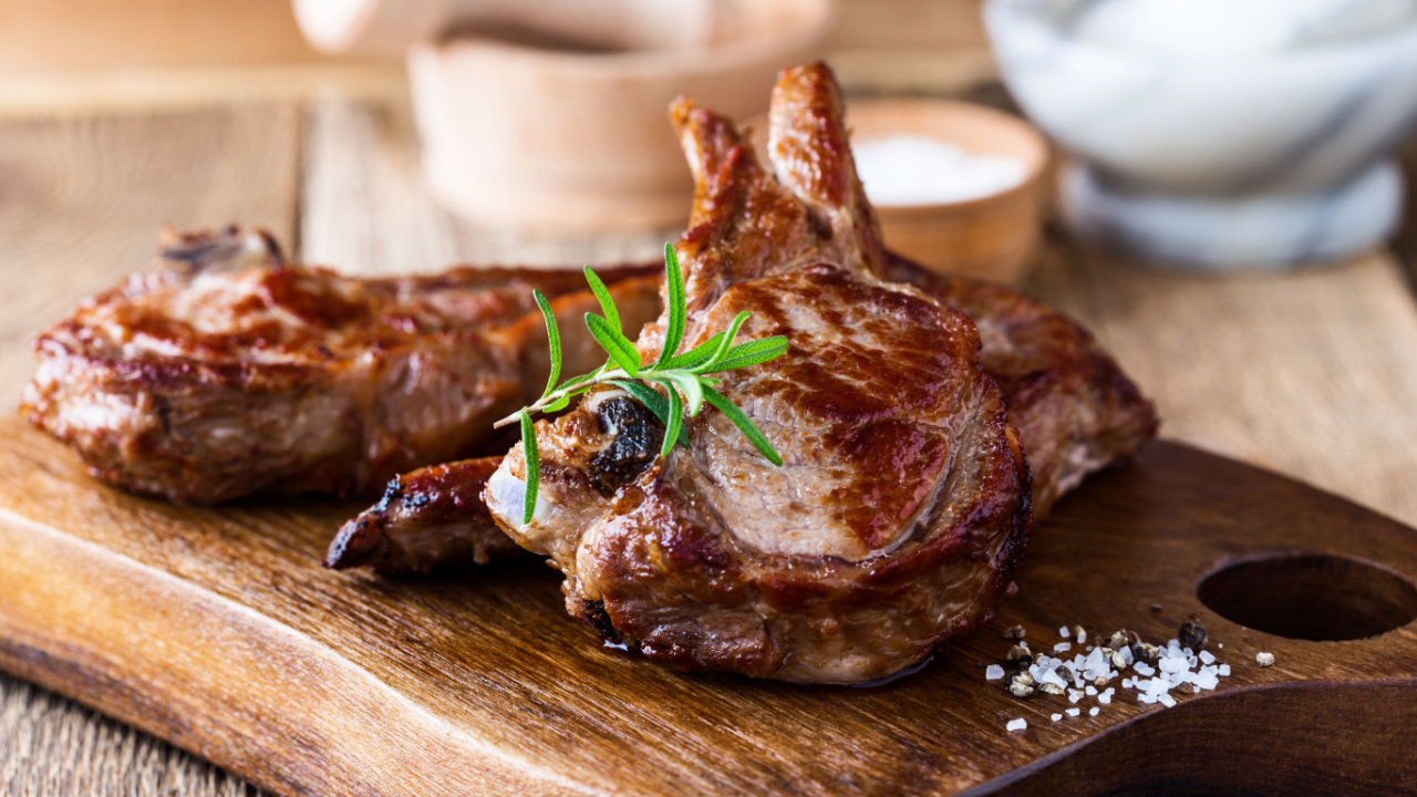 Steak on a wooden cutting board.