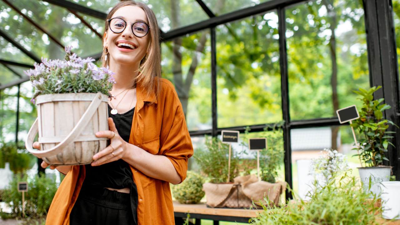 Woman growing her own herbs in her home garden