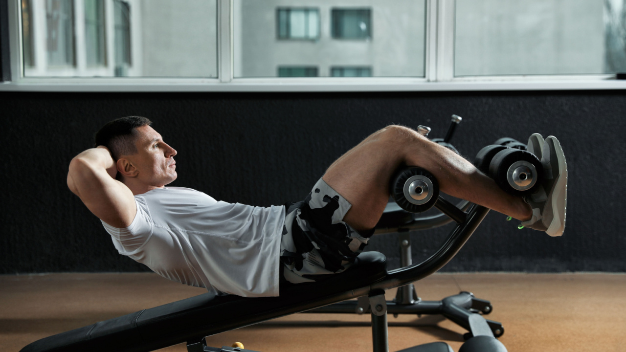 man doing a workout on an adjustable workout bench