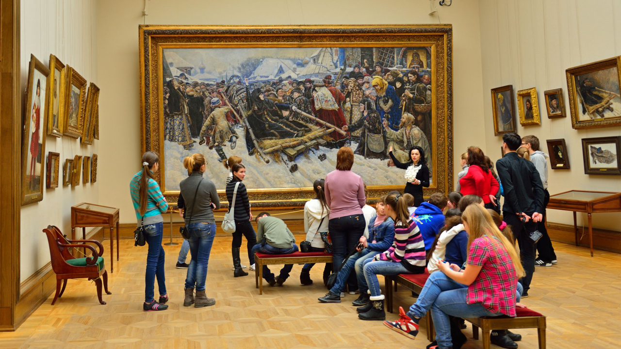 people looking at museum art