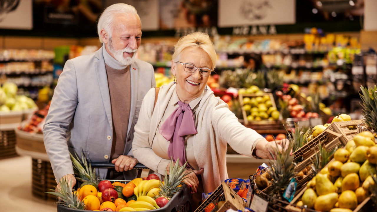 elderly couple grocery shopping