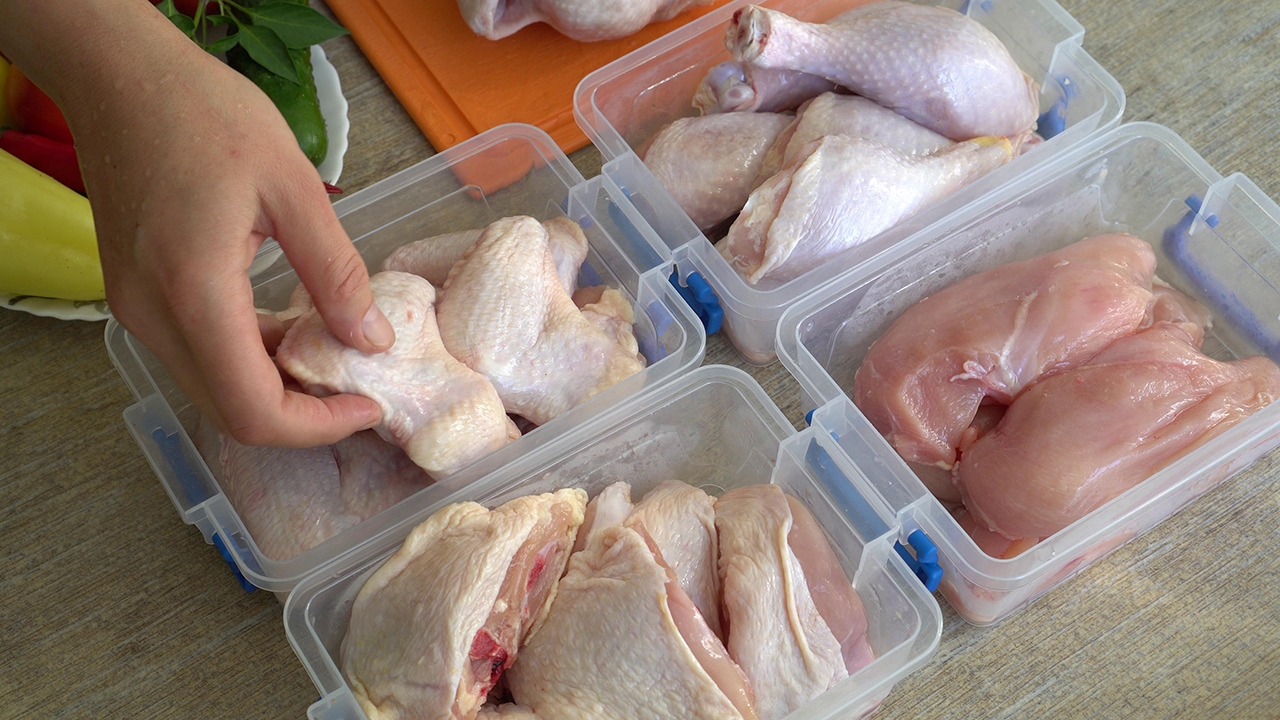 Housewife Portions Out Whole Chicken, And Freeze Pieces In A Separate Container. Chicken: Cutting, Freezing, Storing, Marinating, Cooking at Home