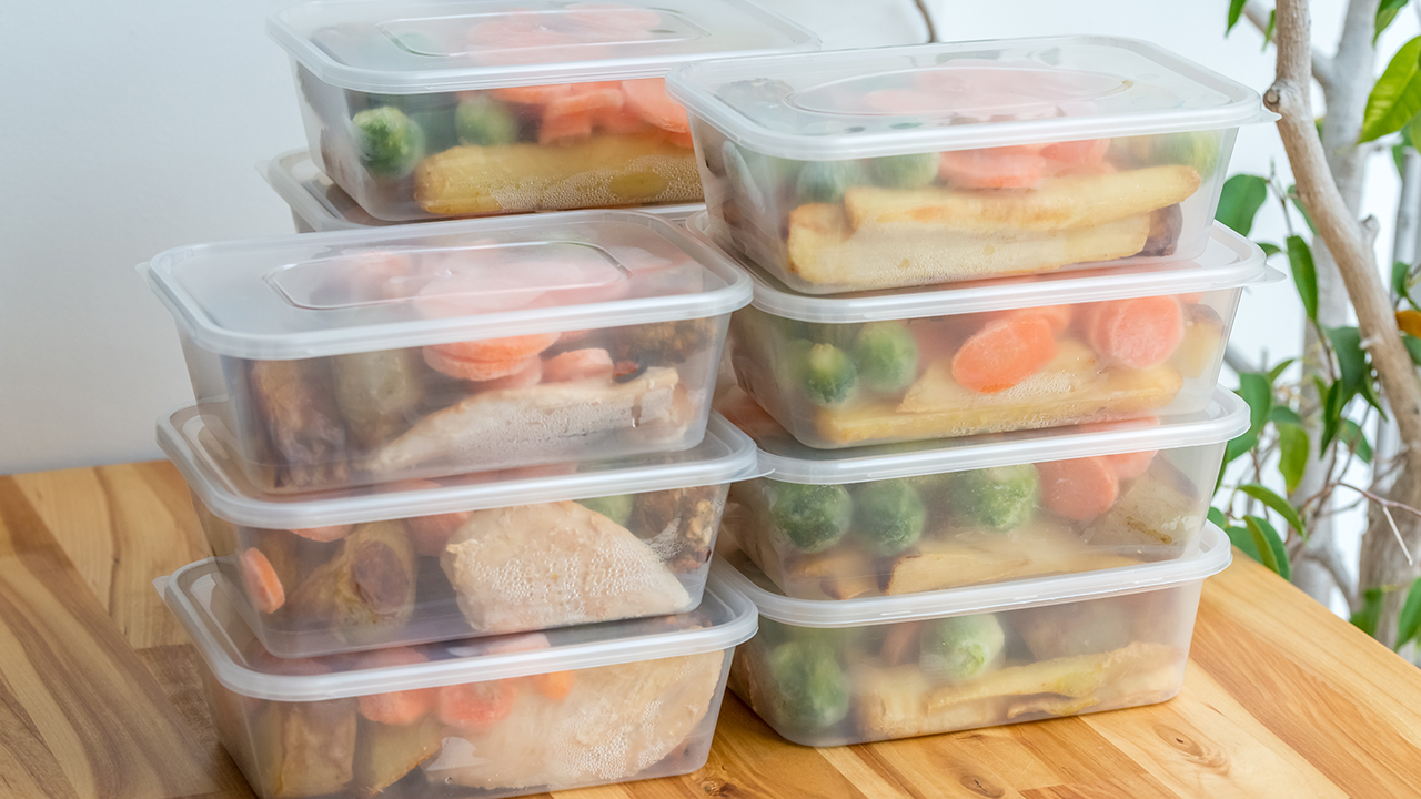Meal prep. Stack of home cooked roast chicken dinners in containers ready to be frozen for later use.